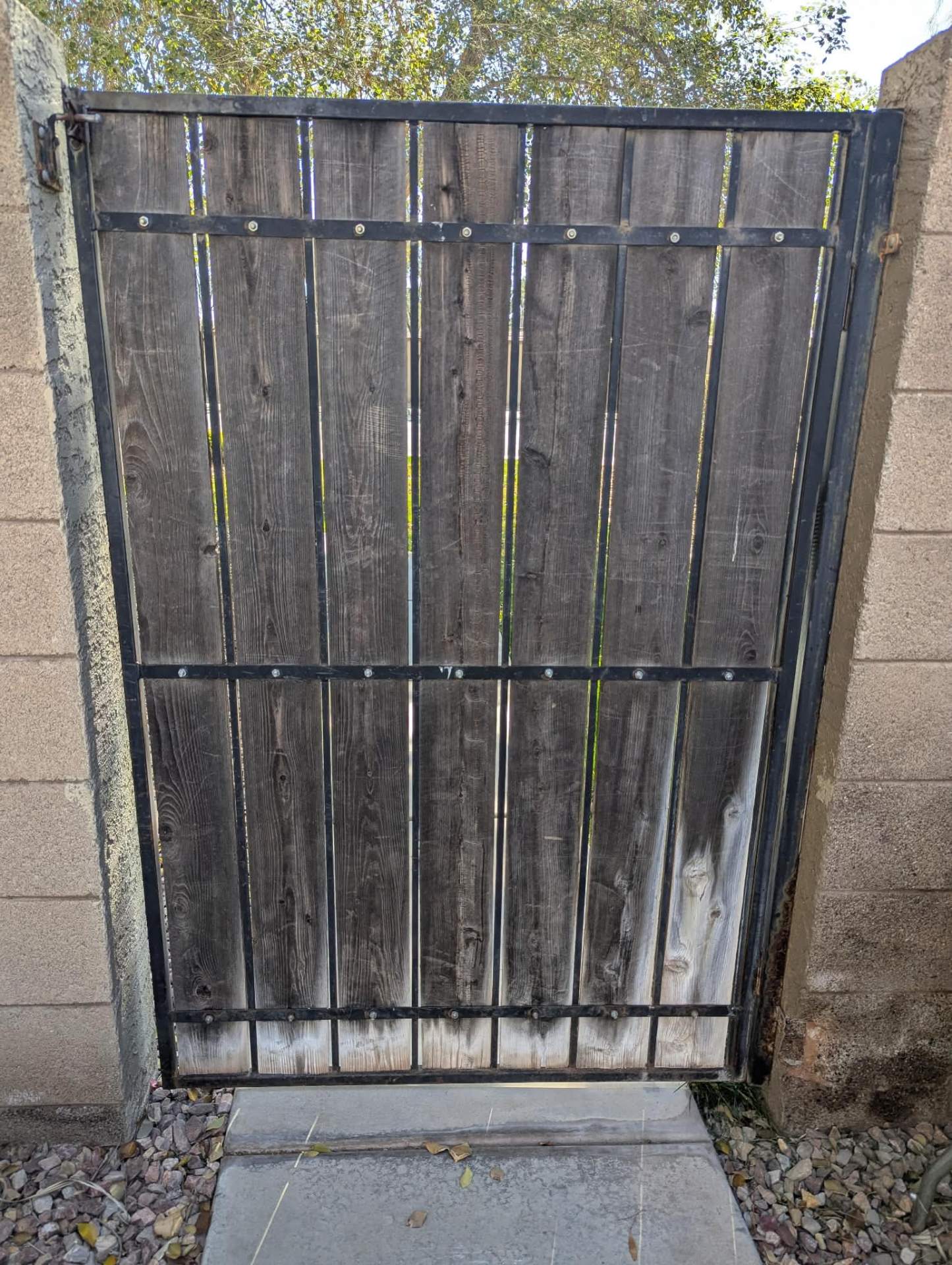 Old rotted wood gate before replacement