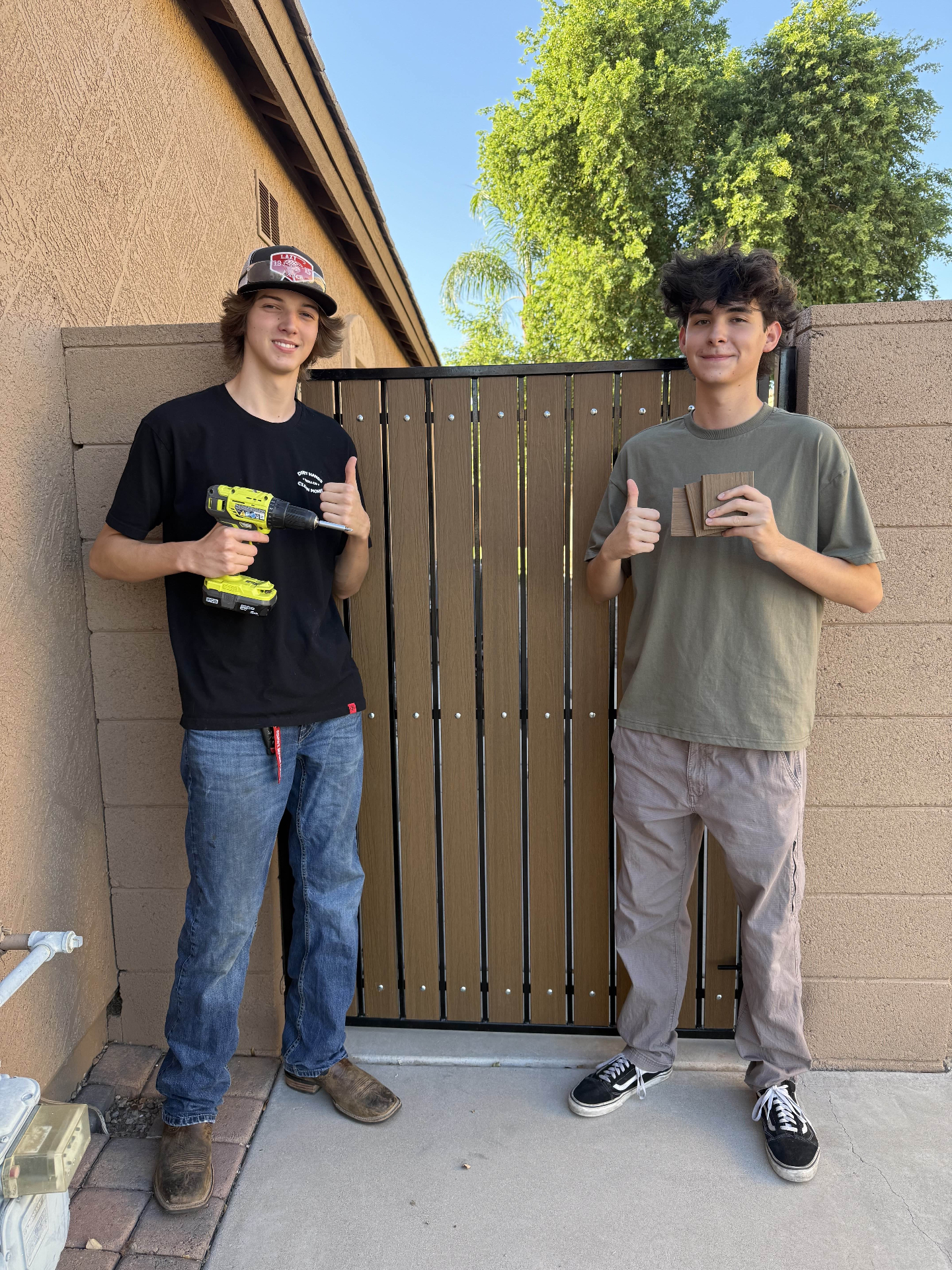 The two founders of GateLifeAZ standing in front of a finished composite gate